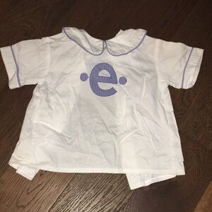 White Shirt with Blue Letter Design